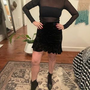 Velvet skirt with rushing detail. Black and frilly.